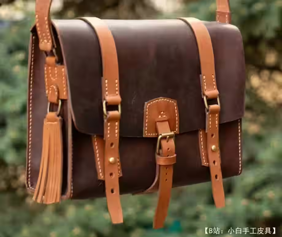 带闭合带的皮革邮差包图案 - 1